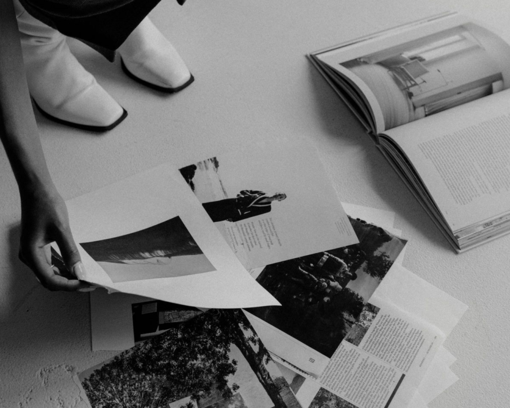 Woman picking photos on the floor for her Branding logo and her brand identity 